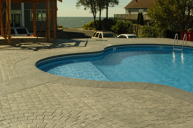 Swimming pool and stamped concrete project example 9